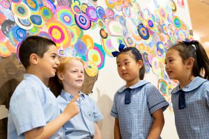 St Therese Mascot Catholic Primary School Mission and Values Students in front of colourful paper tree